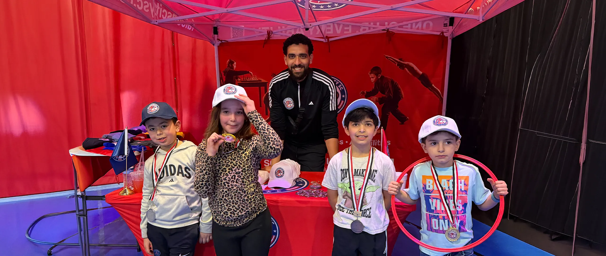Falcons City SC serving children and families at a community event